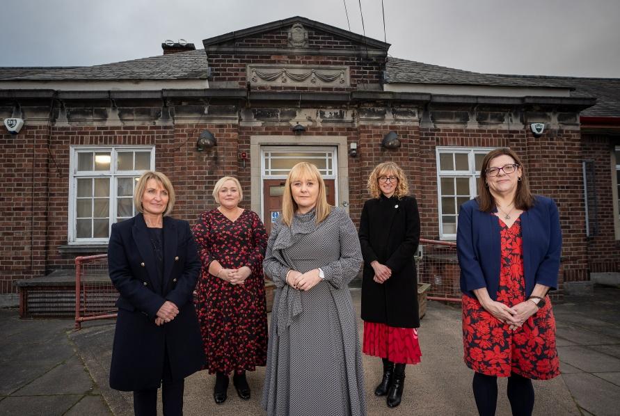 Image of Education Minister NI alongside professionals for the roll of of Trauma Informed Practice